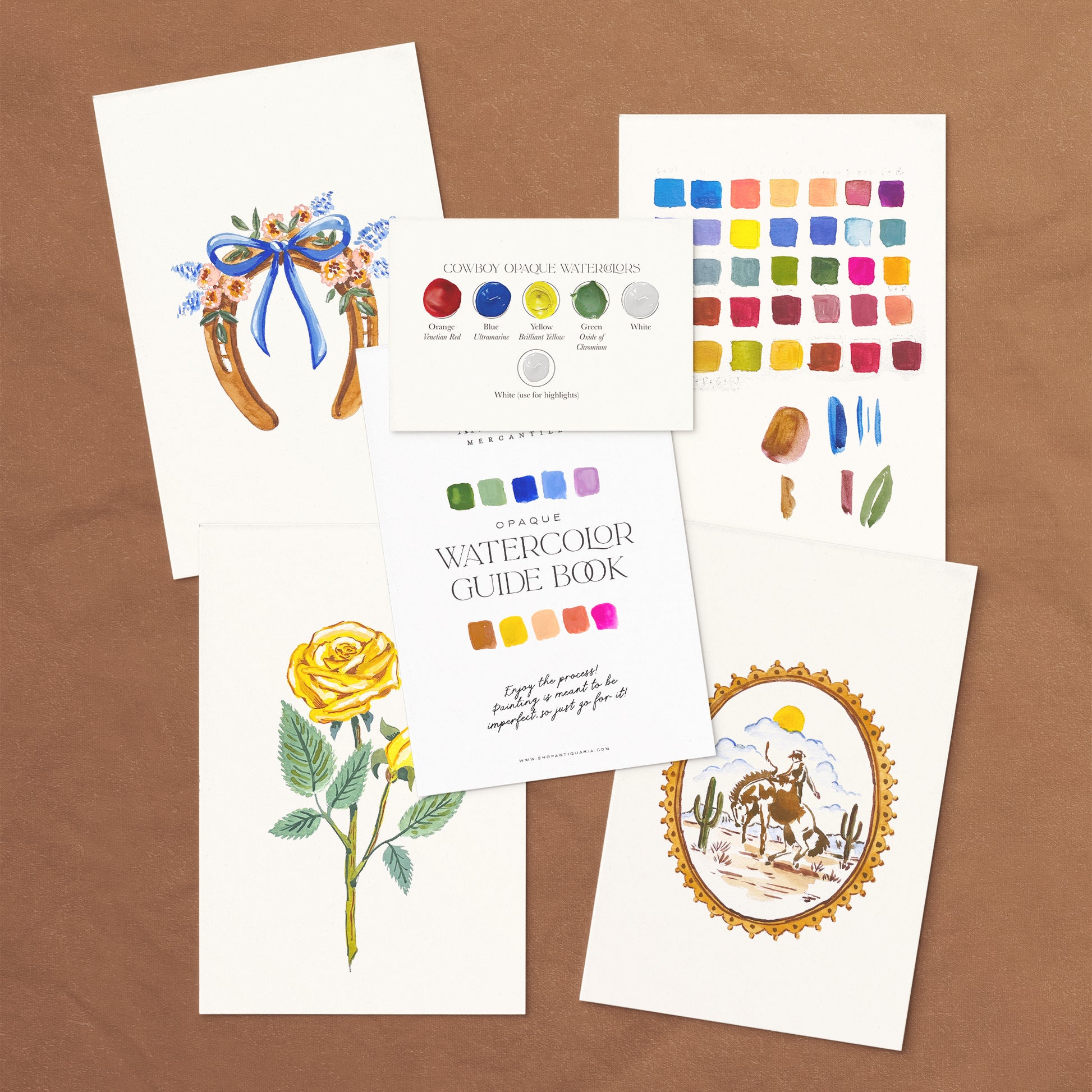 Vintage Cowboy Watercolor Kit with guide book and paint swatches on a gray background