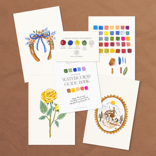Vintage Cowboy Watercolor Kit with guide book and paint swatches on a gray background