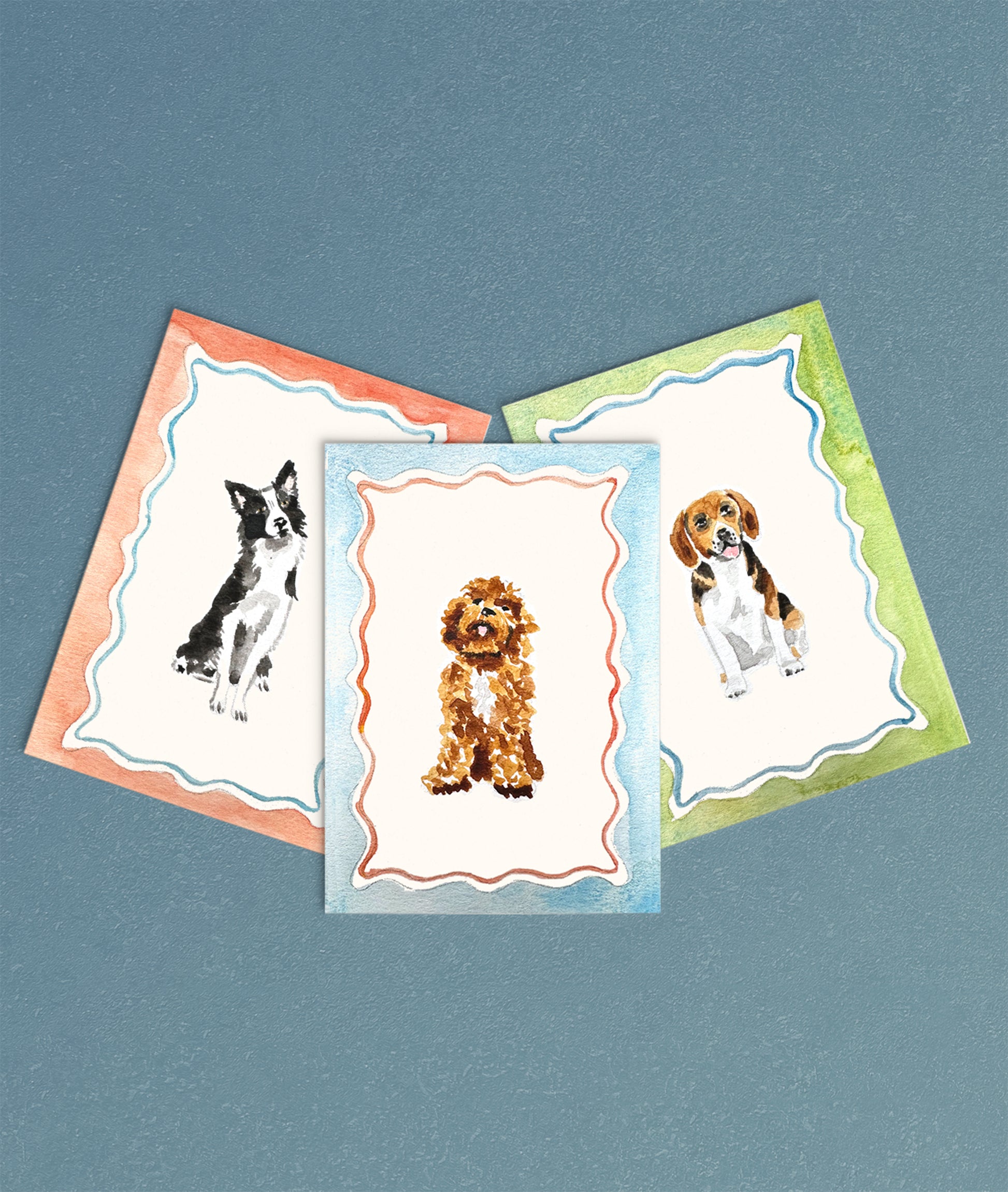 Three dog-themed greeting cards with different breeds on a blue background