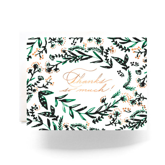 Thank you card with a lush emerald green and gold wreath and elegant thank-you message.