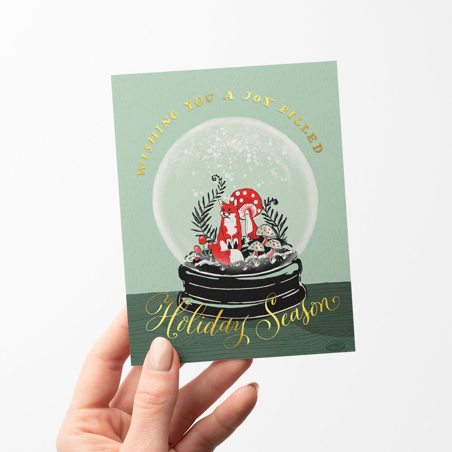 Fox snowglobe holiday card, featuring a cute fox inside a snowglobe, perfect for winter holiday greetings, blank inside.