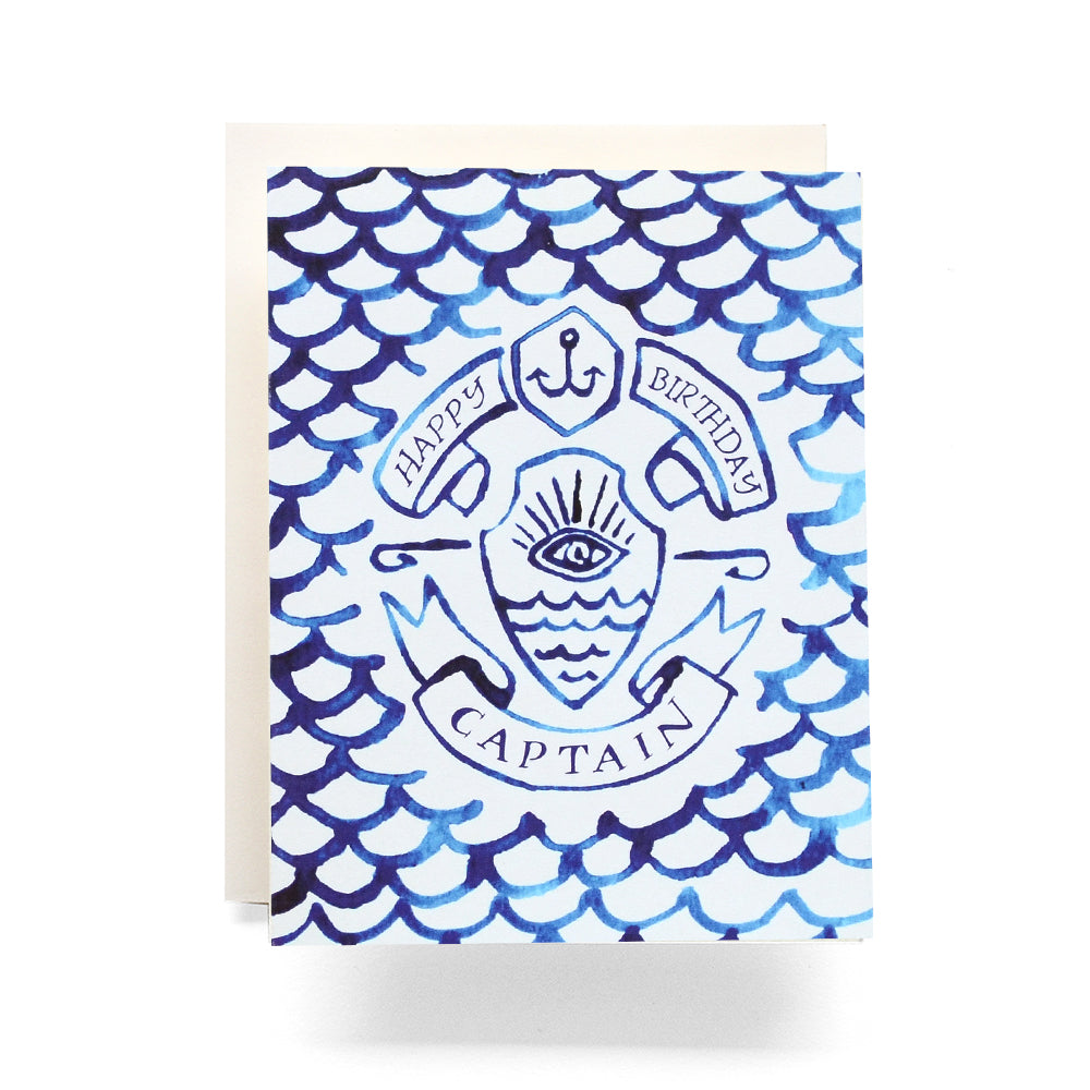 Nautical birthday card with an indigo-hued fish scale and anchor, perfect for celebrating a maritime enthusiast's special day