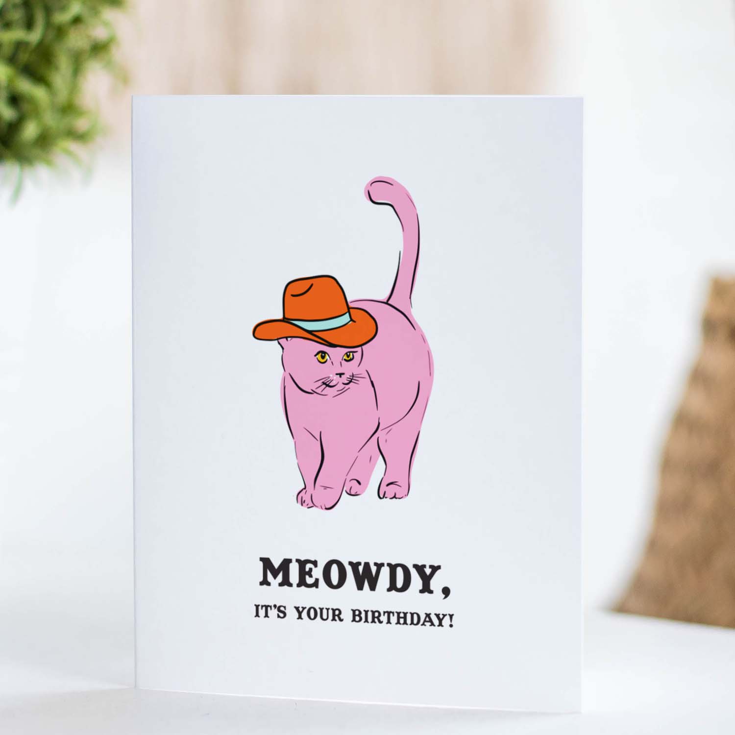 Birthday card with a pink cat in a cowboy hat and text 'Meowdy It's Your Birthday.