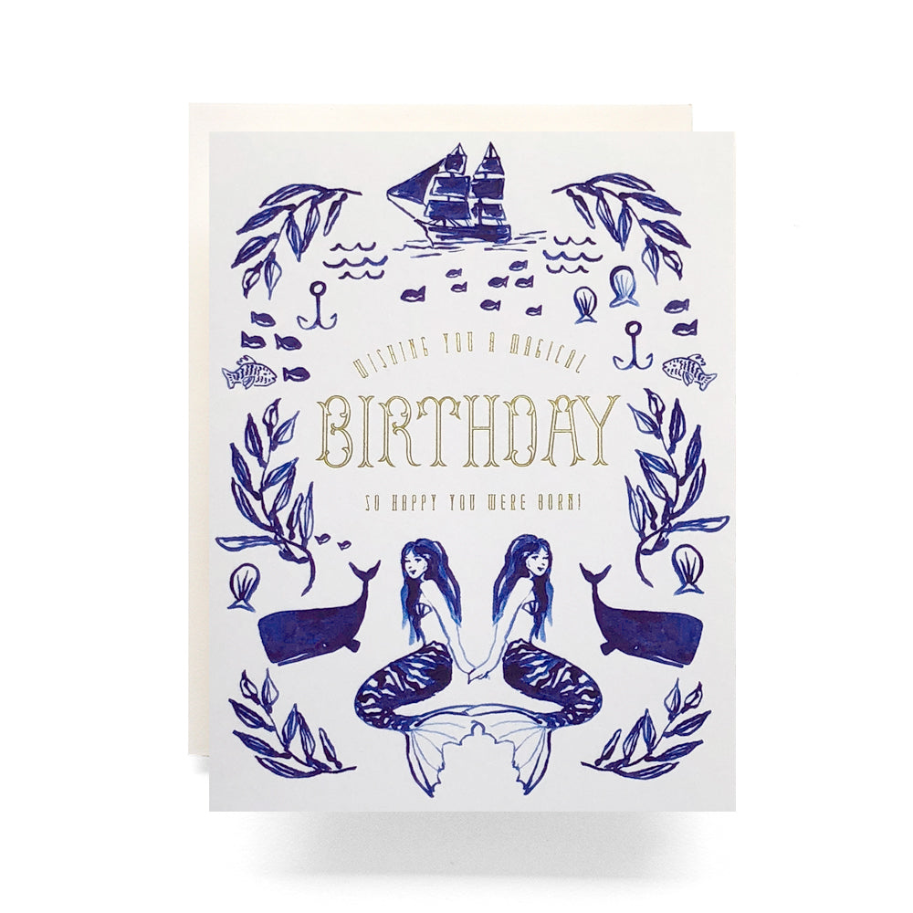 Enchanting birthday card featuring a mermaid, sailing ships, and other ocean illustrations, ideal for a whimsical celebration.