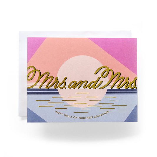 Modern Mrs. & Mrs. wedding card featuring a stylish design of a sun setting over the ocean - ideal for celebrating same-sex marriages.