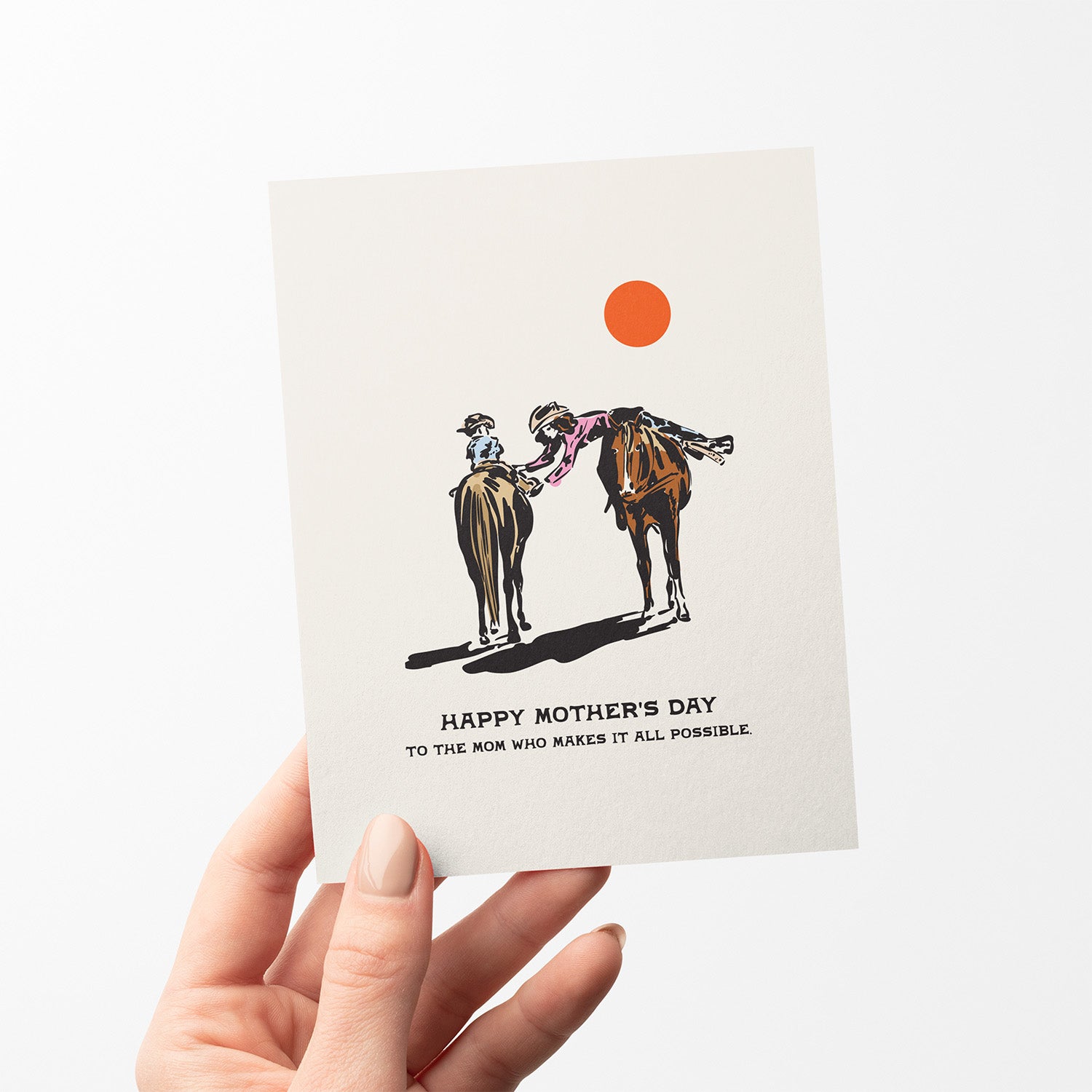 Mother’s Day card with an illustration of a mother and child on a horse, mother helping child, and the phrase 'Happy Mother’s Day to the mom who makes it all possible.