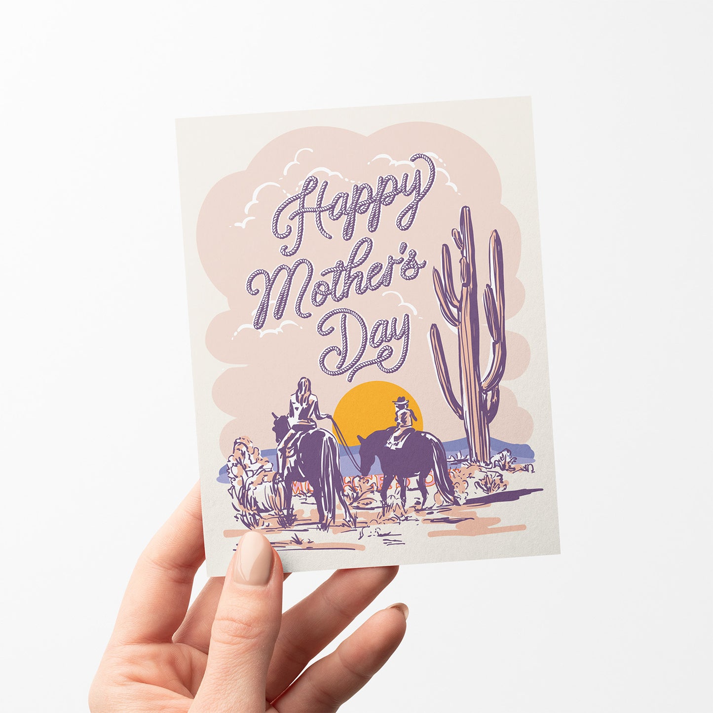 Mother’s Day card featuring an illustration of a mother and child on horses in a pastel desert landscape.