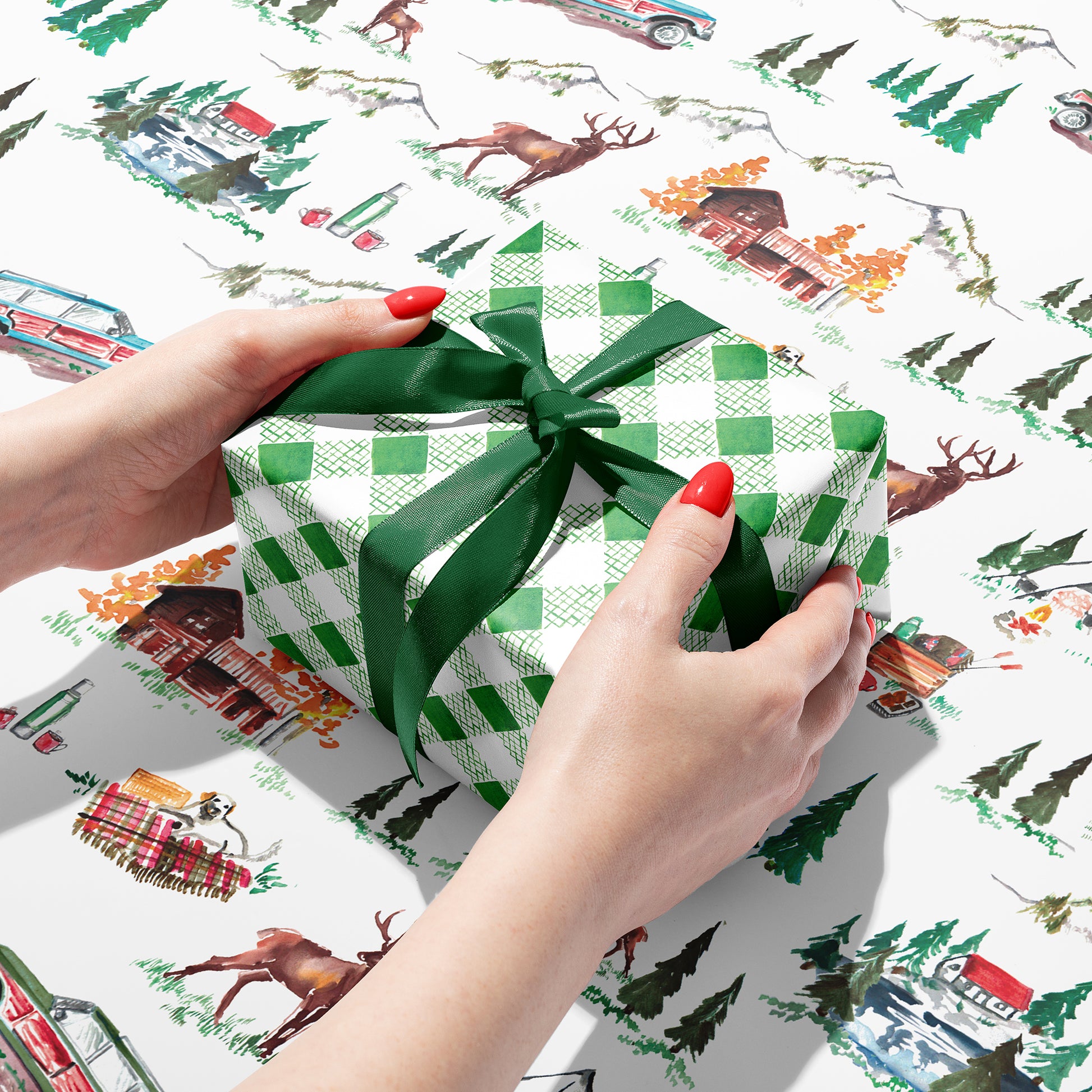 Sustainable gift wrap with cabin themed design on one side and a green plaid pattern on the reverse side, perfect for any occasion. 100% recyclable and compostable.