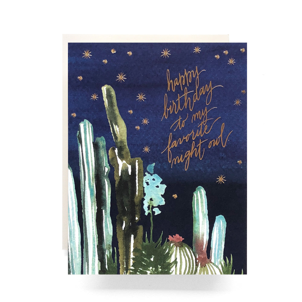 Mystical birthday card featuring watercolor cacti under a starry night sky, creating a tranquil desert scene for a unique celebration.