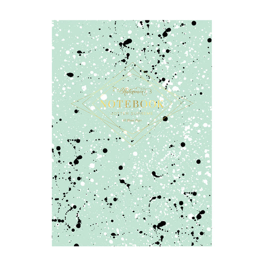 Teal and black softcover staple-bound notebook featuring a paint splatter design. Blank interior pages. 