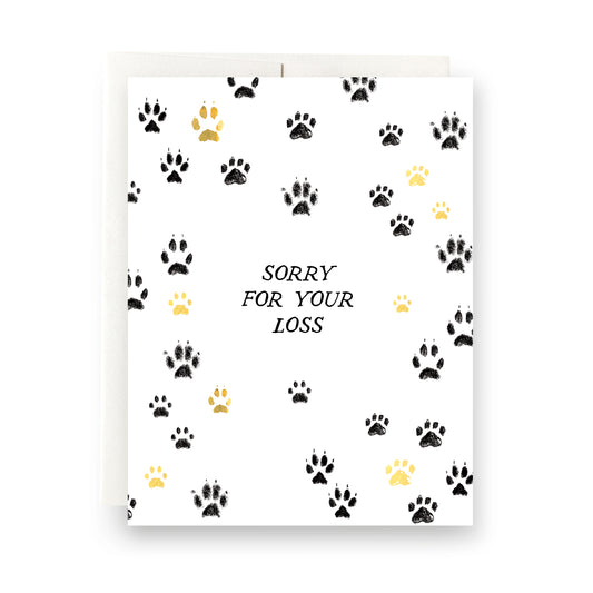 Paw prints with 'Sorry for Your Loss' text on a blank pet sympathy card.