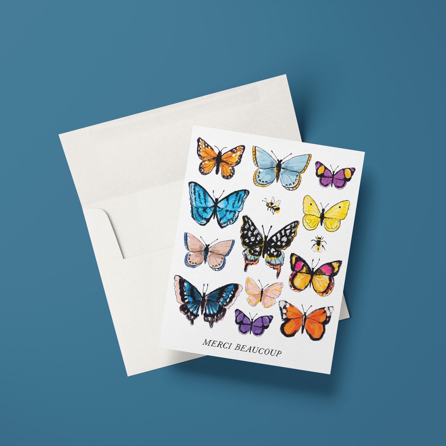 Thank you card with delicate watercolor butterflies and 'Merci beaucoup' in elegant script, perfect for any occasion