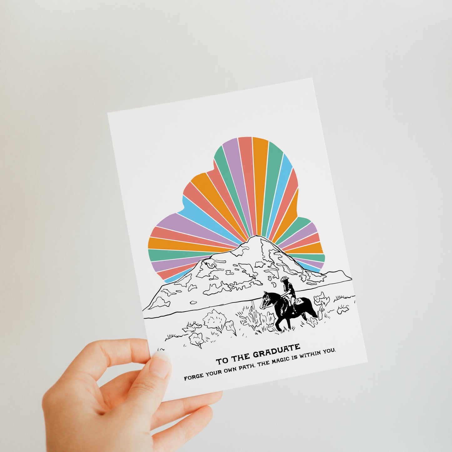 Cosmic Cowboy Grad card with a unique western theme, with a rainbow cloud ideal for graduates with a sense of adventure.