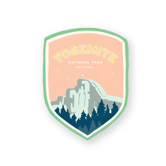 A Yosemite National Park sticker featuring the iconic half dome, including mountains, and evergreen trees, perfect for outdoor enthusiasts and nature lovers.