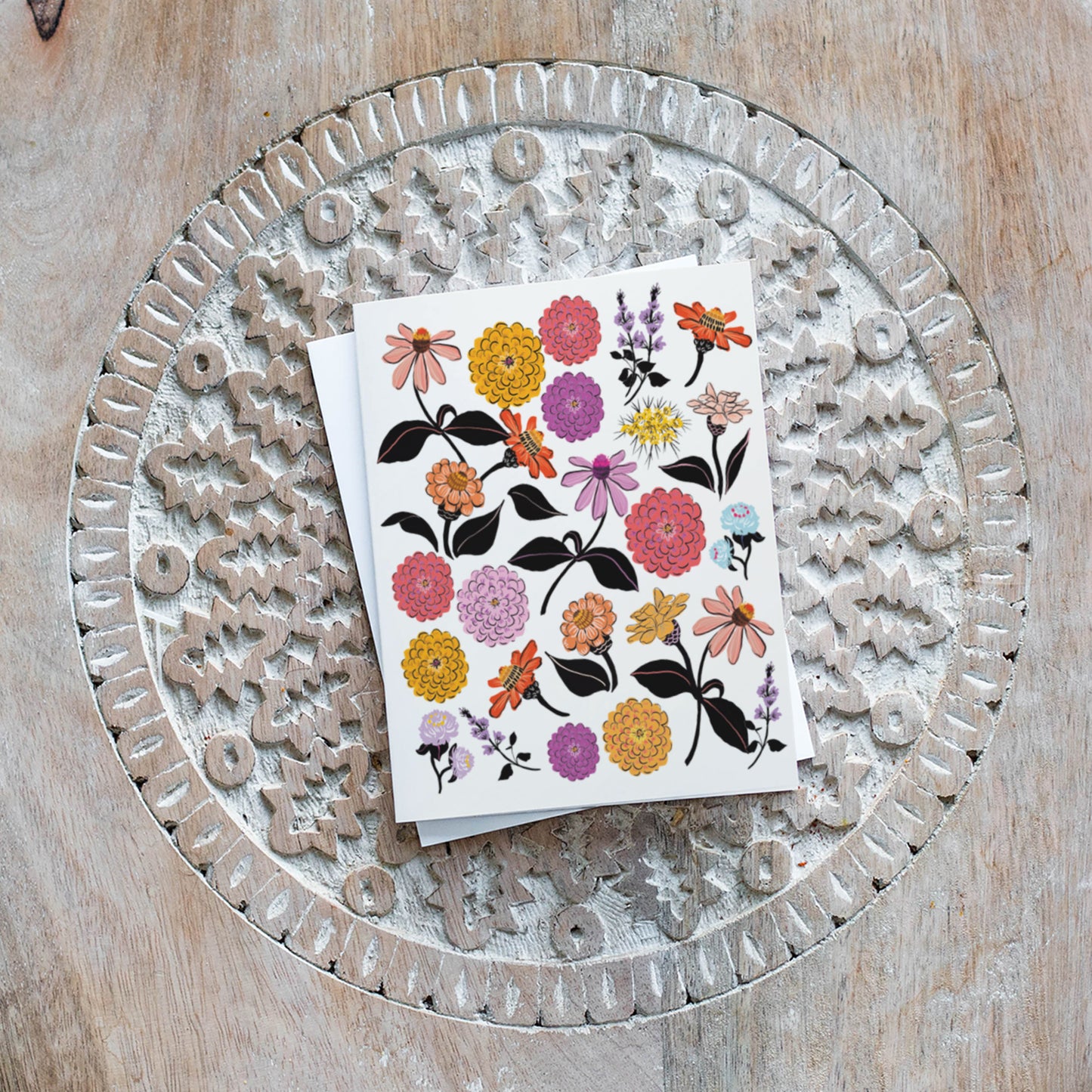 Blank card with hand-illustrated zinnia flowers, ideal for any occasion and flower lovers.
